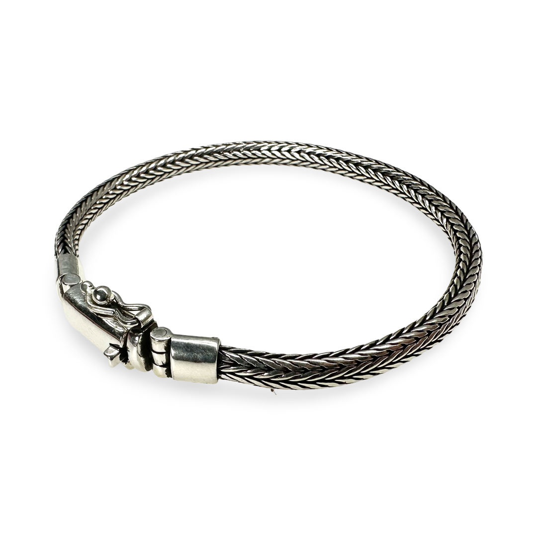 Elegant silver snake bracelet with striking clasp