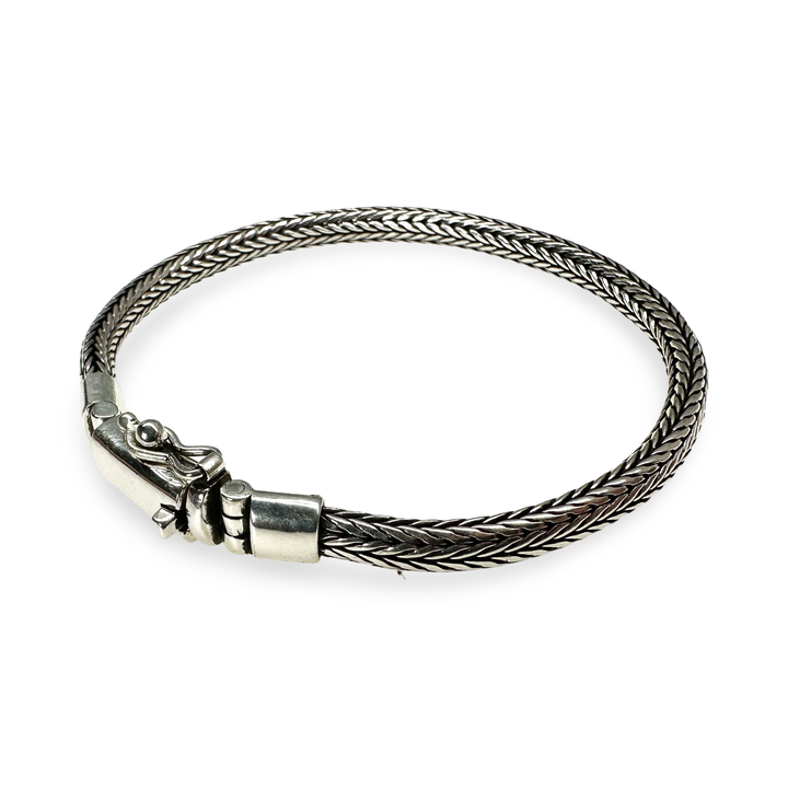 Elegant silver snake bracelet with striking clasp