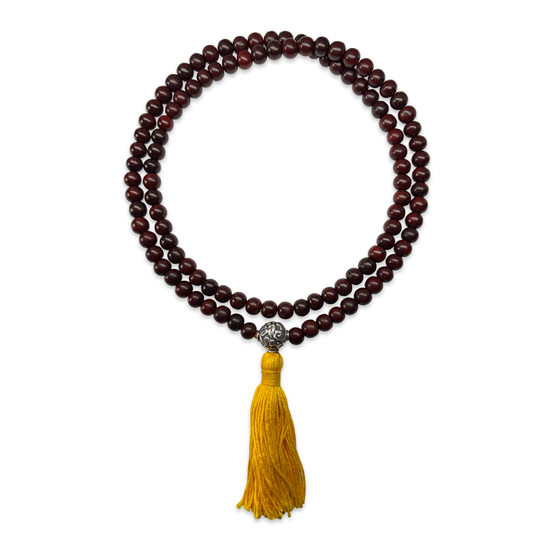 Delicate sandalwood mala with silver bead