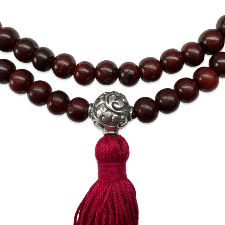 Delicate sandalwood mala with silver bead