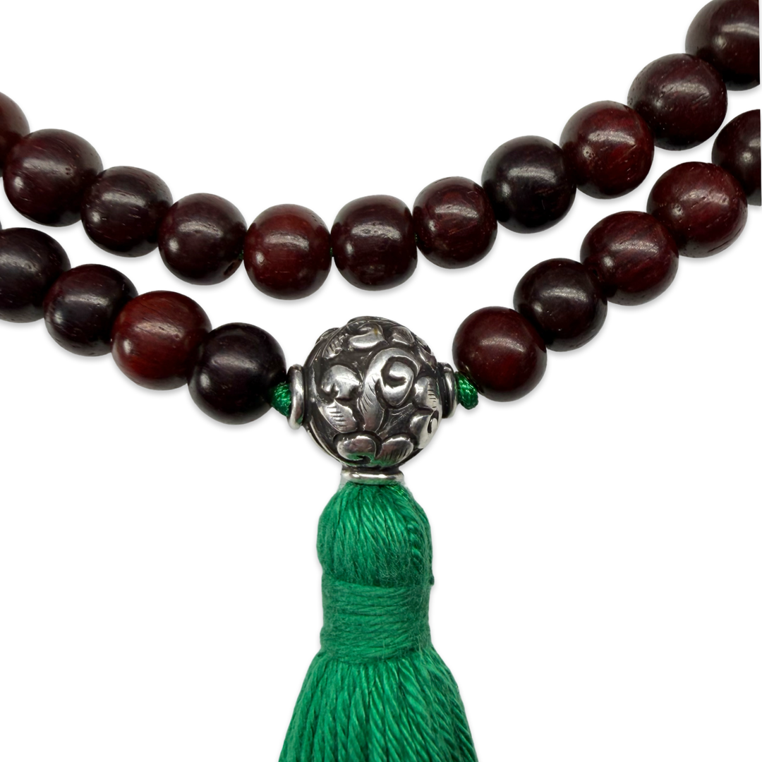 Delicate sandalwood mala with silver bead