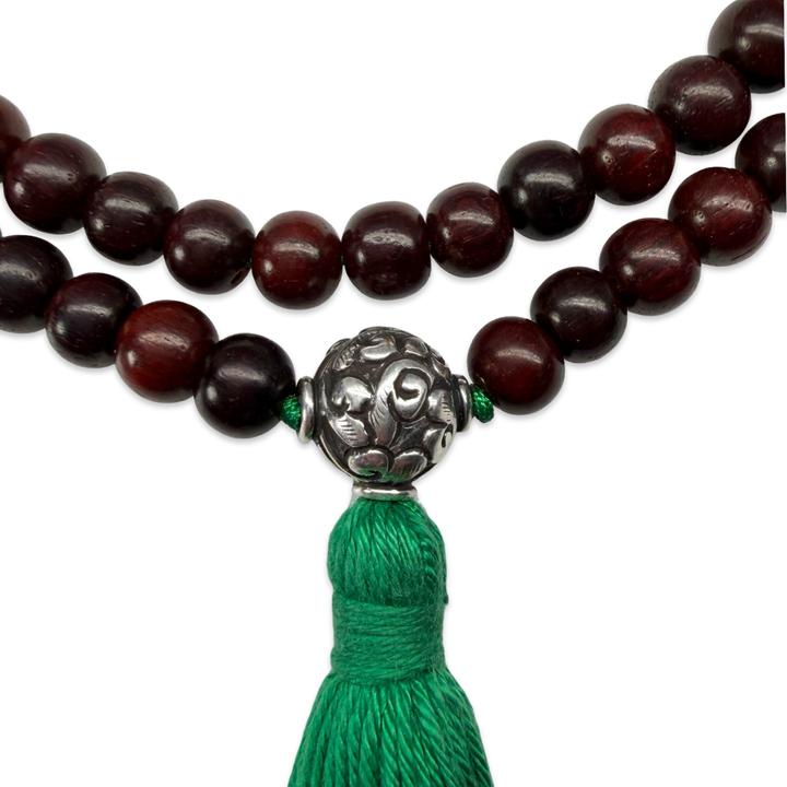 Delicate sandalwood mala with silver bead
