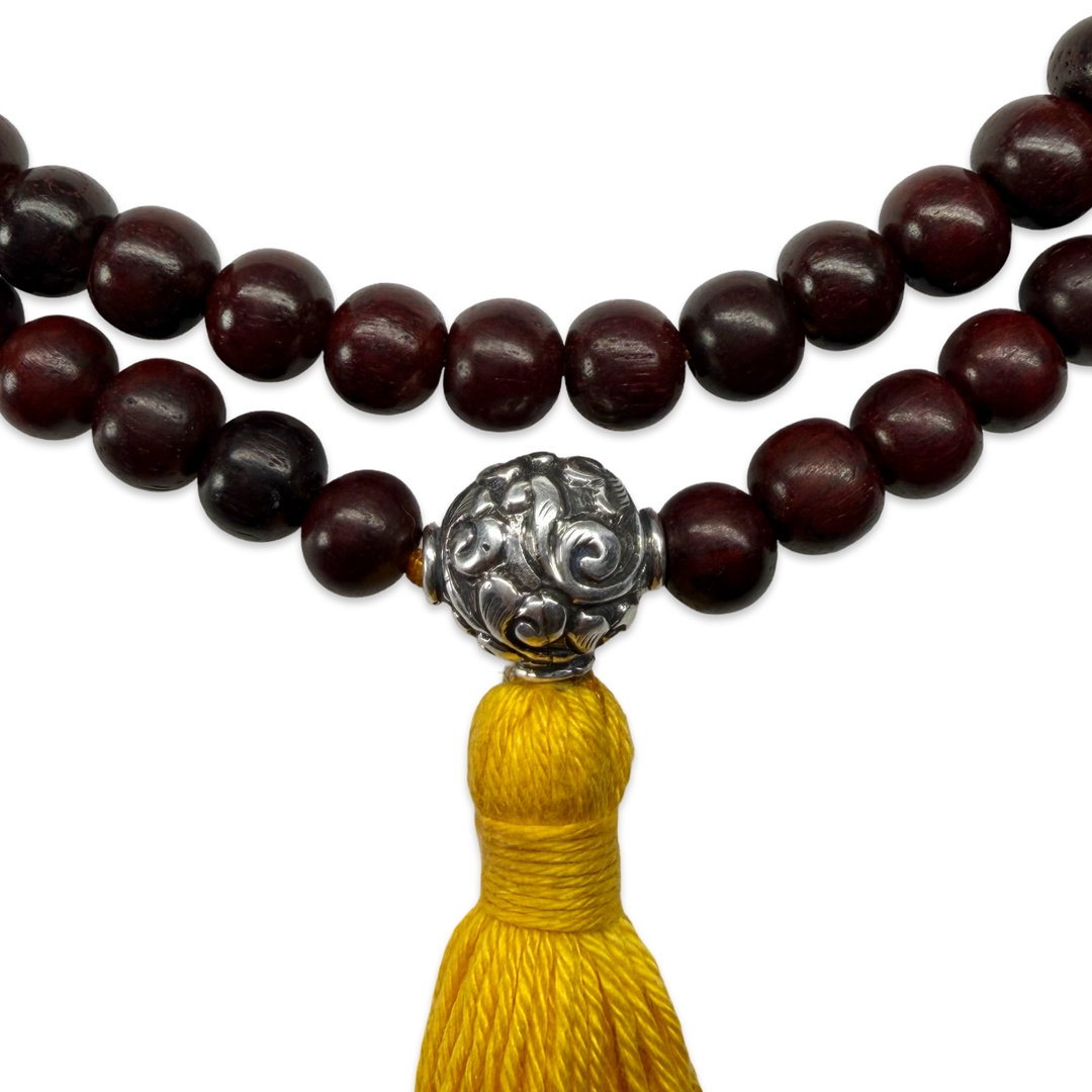Delicate sandalwood mala with silver bead