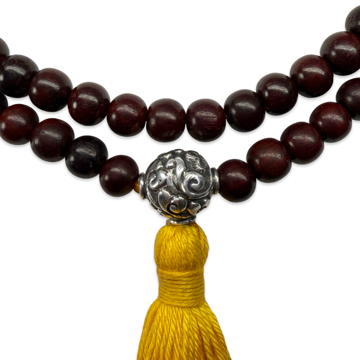 Delicate sandalwood mala with silver bead