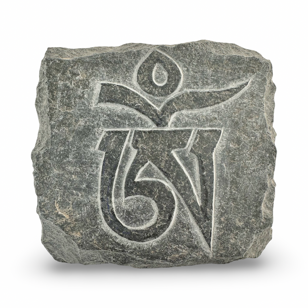 Mani stone with the Tibetan "OM" ཨོཾ