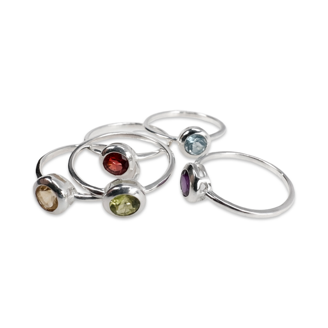 Delicate, elegant silver ring with colored oval gemstone