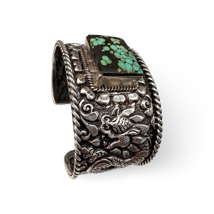 Schwere Armspange aus Silber mit Drachenmotiv und Türkis