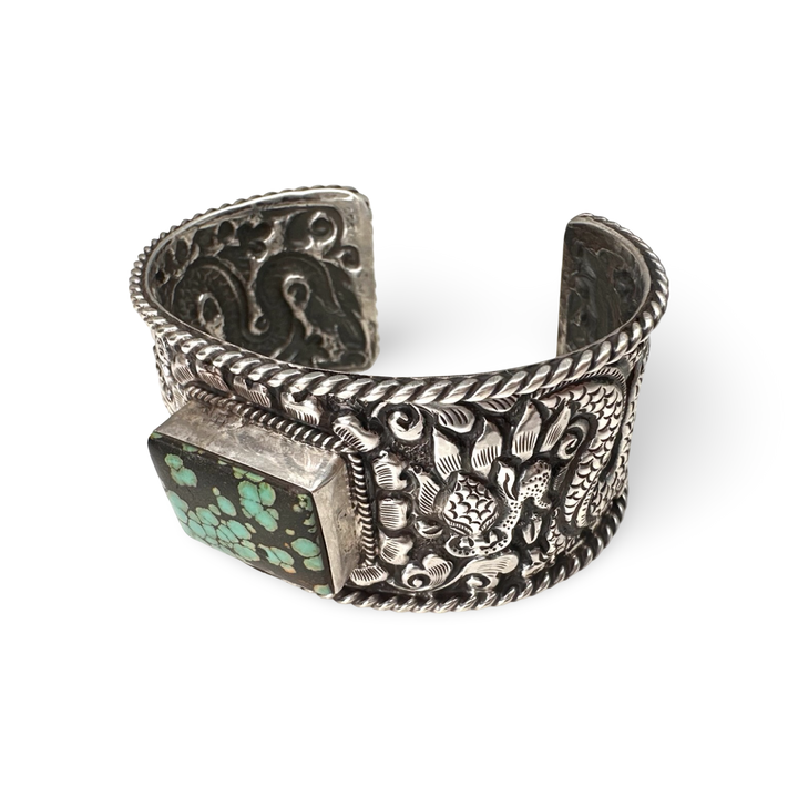 Schwere Armspange aus Silber mit Drachenmotiv und Türkis