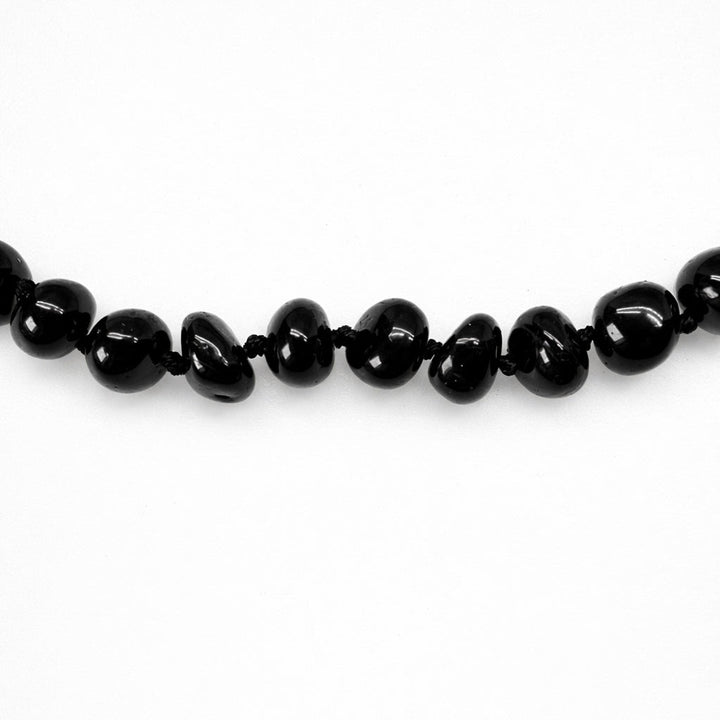 Halskette aus dunkelroten Bernsteinen - Atelier Tibet